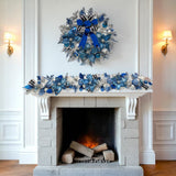 Lux Blue Silver Christmas Garland with jeweled ornaments, blue velvet ribbon, faux poinsettias, and glitter foliage – handcrafted holiday décor for mantle or doorway.