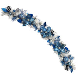 Lux Blue Silver Christmas Garland with jeweled ornaments, blue velvet ribbon, faux poinsettias, and glitter foliage – handcrafted holiday décor for mantle or doorway.